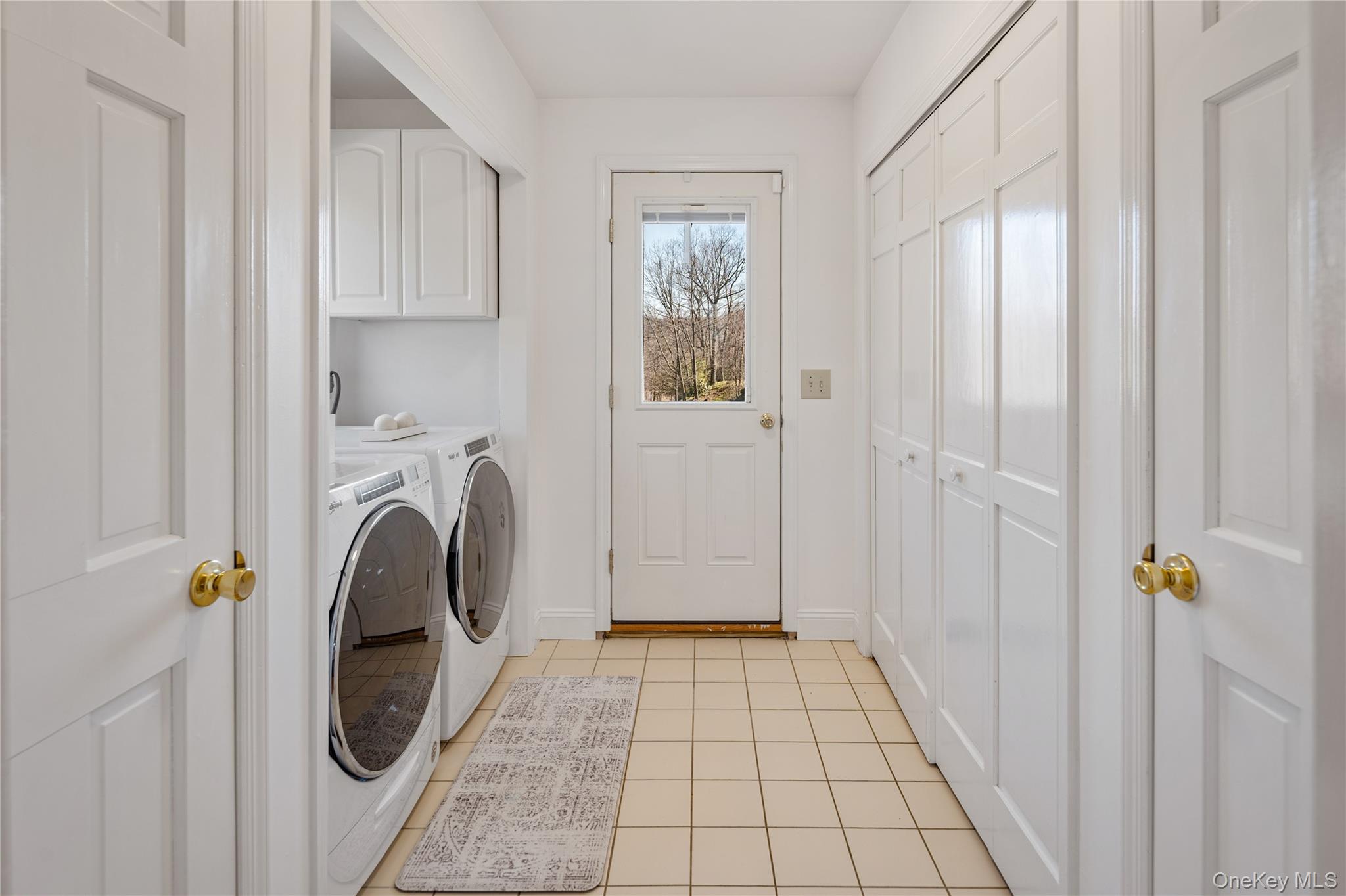 15 Cross Road Cortlandt Manor, NY 10567 - Photo 22 of 50 a view of a hallway with washer and dryer