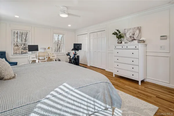a bed room with a bed window and a dresser