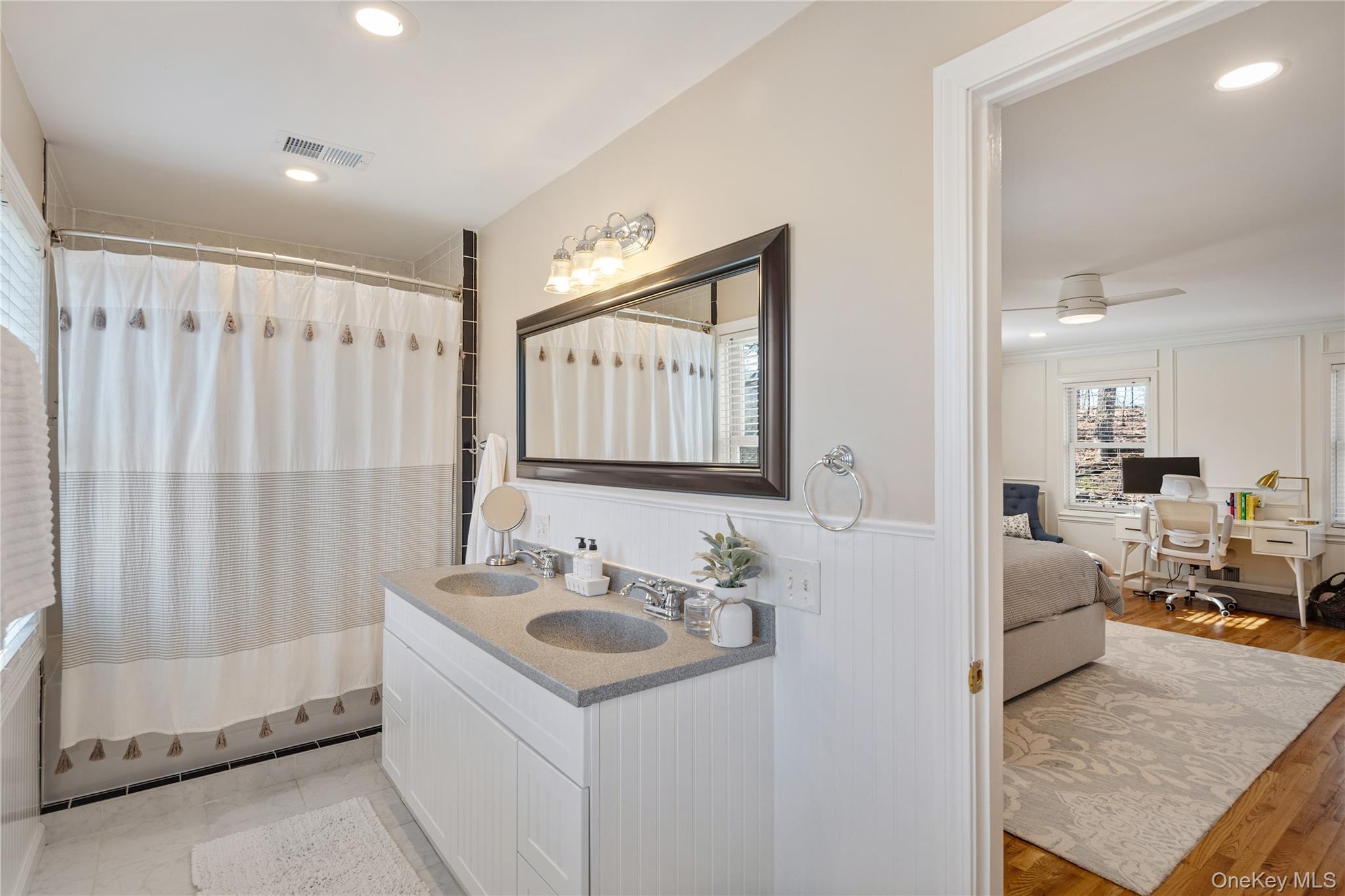 15 Cross Road Cortlandt Manor, NY 10567 - Photo 27 of 50 a en suite bathroom with a sink double vanity and a mirror