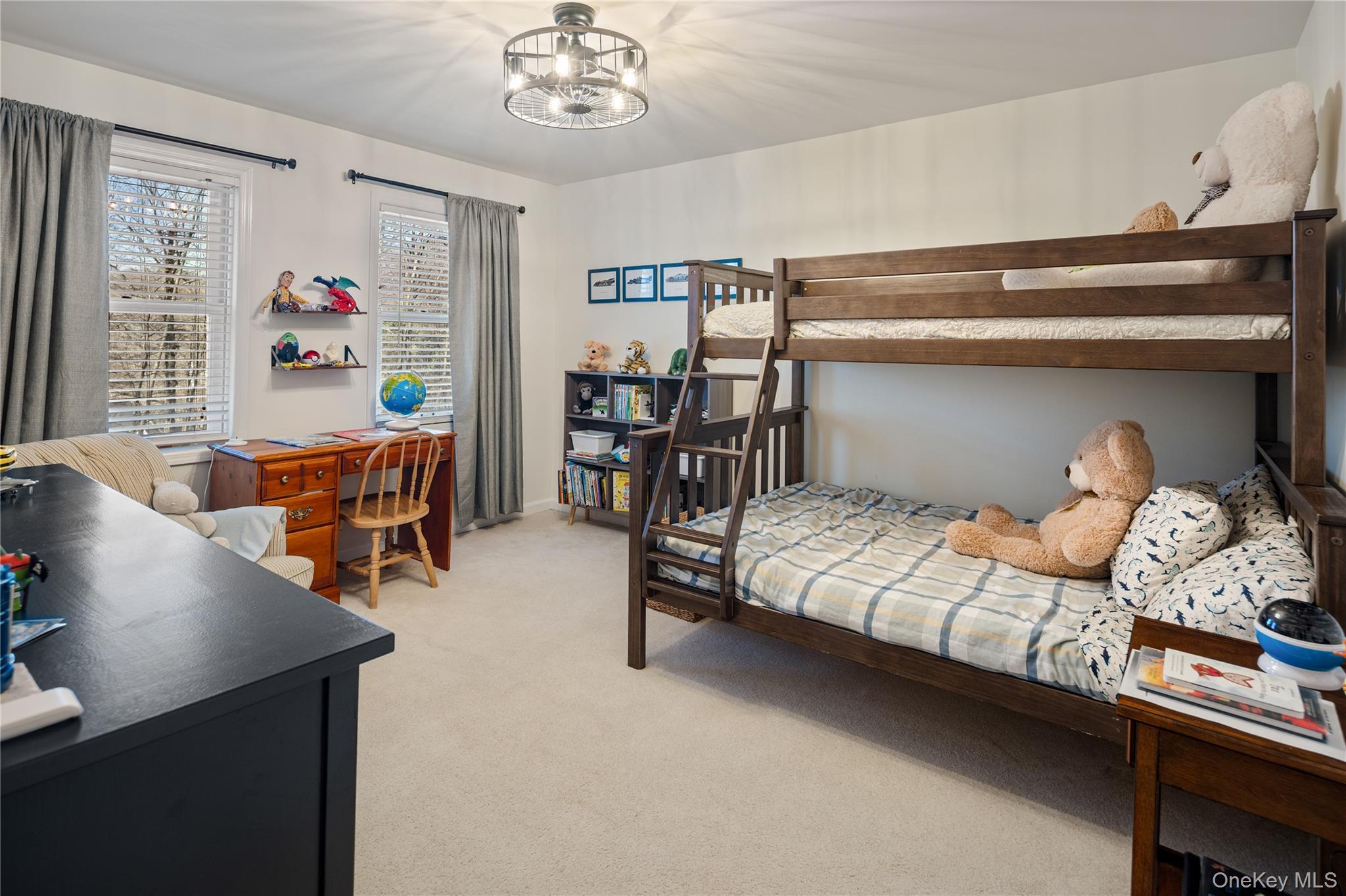 15 Cross Road Cortlandt Manor, NY 10567 - Photo 29 of 50 a bedroom with furniture and a chandelier