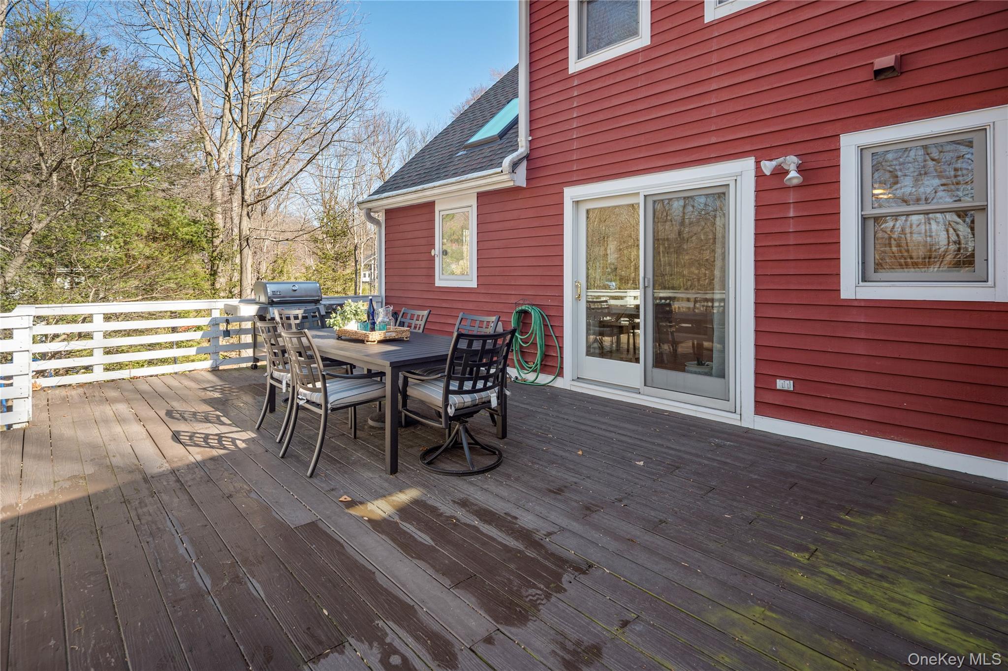 15 Cross Road Cortlandt Manor, NY 10567 - Photo 37 of 50 a roof deck with table and chairs and wooden floor