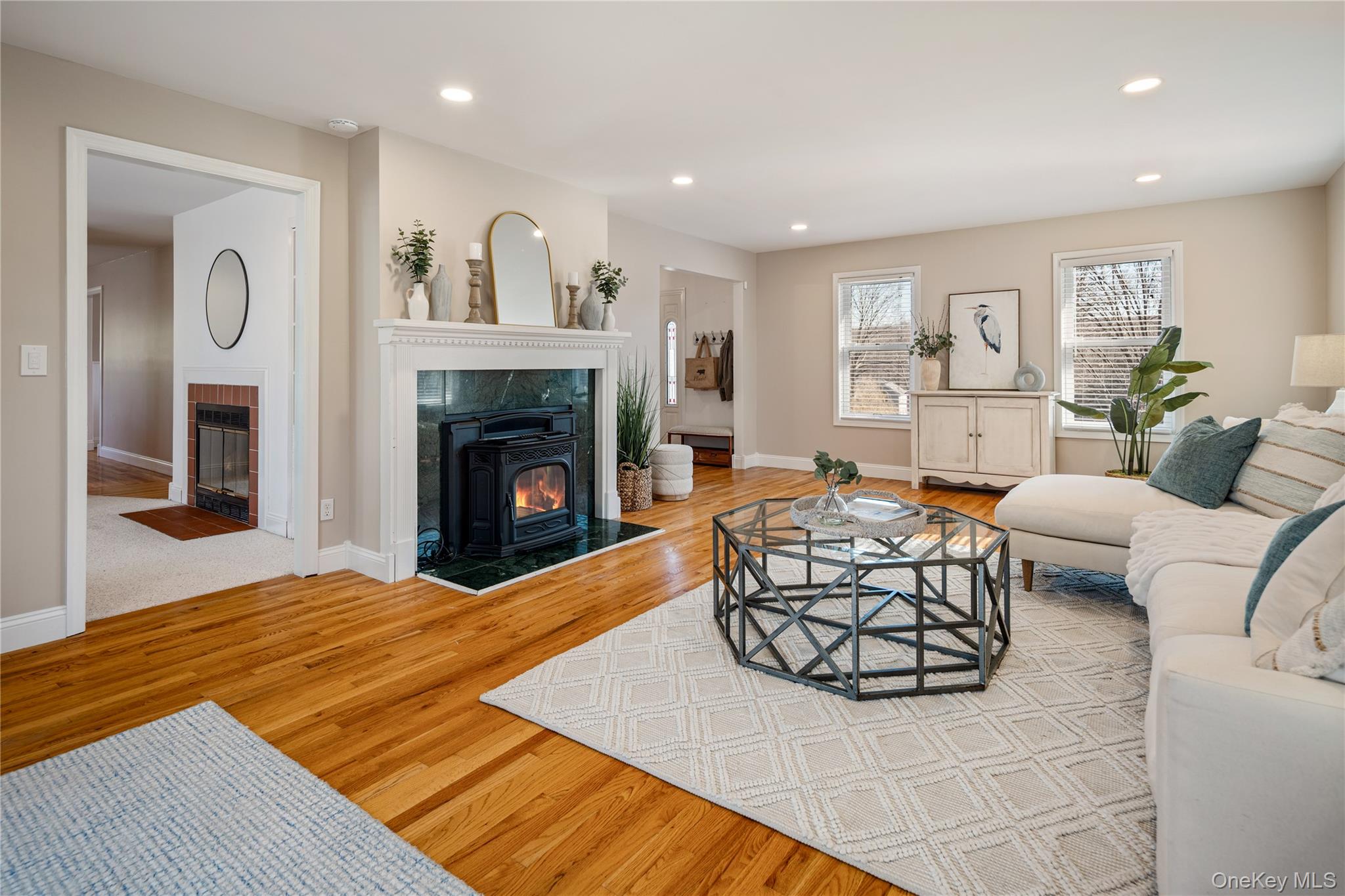 15 Cross Road Cortlandt Manor, NY 10567 - Photo 7 of 50 a living room with furniture and a fireplace