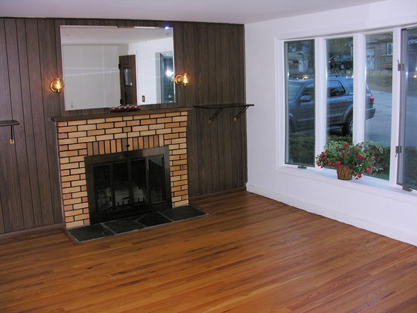 38 Indian Spring Road Ashland, MA 01721 - Photo 5 of 30 a view of a livingroom with wooden floor and a fireplace