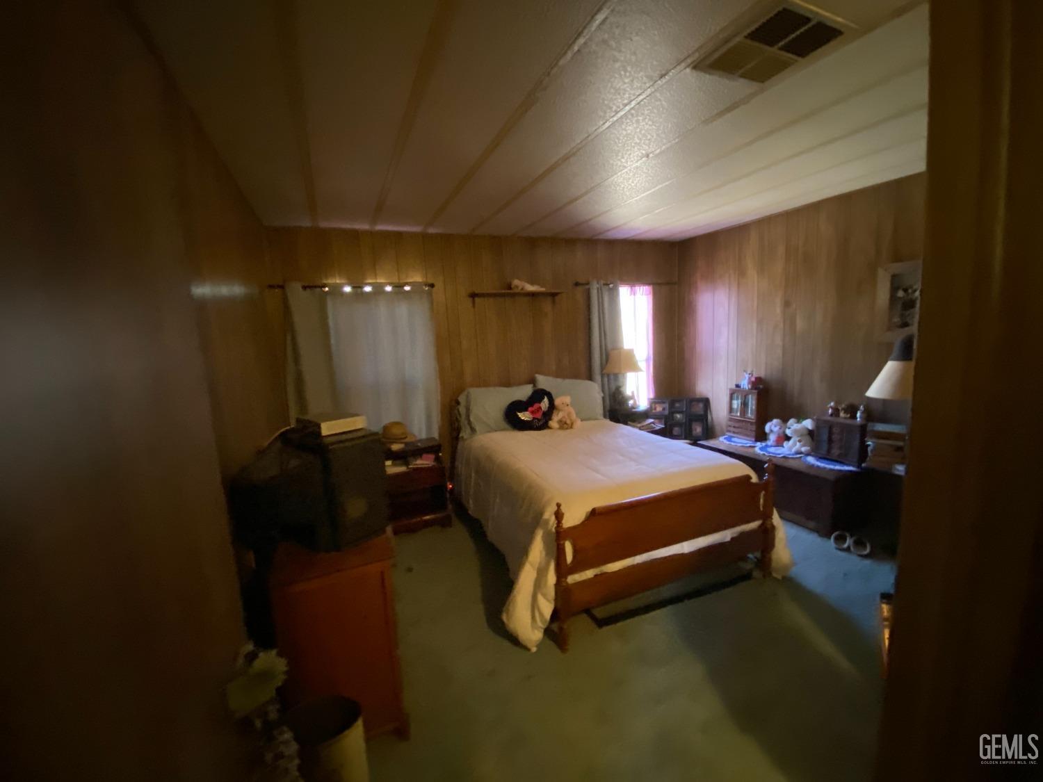 Undisclosed Address Caliente, CA 93518 - Photo 17 of 19 a bed room with a bed and a night stand