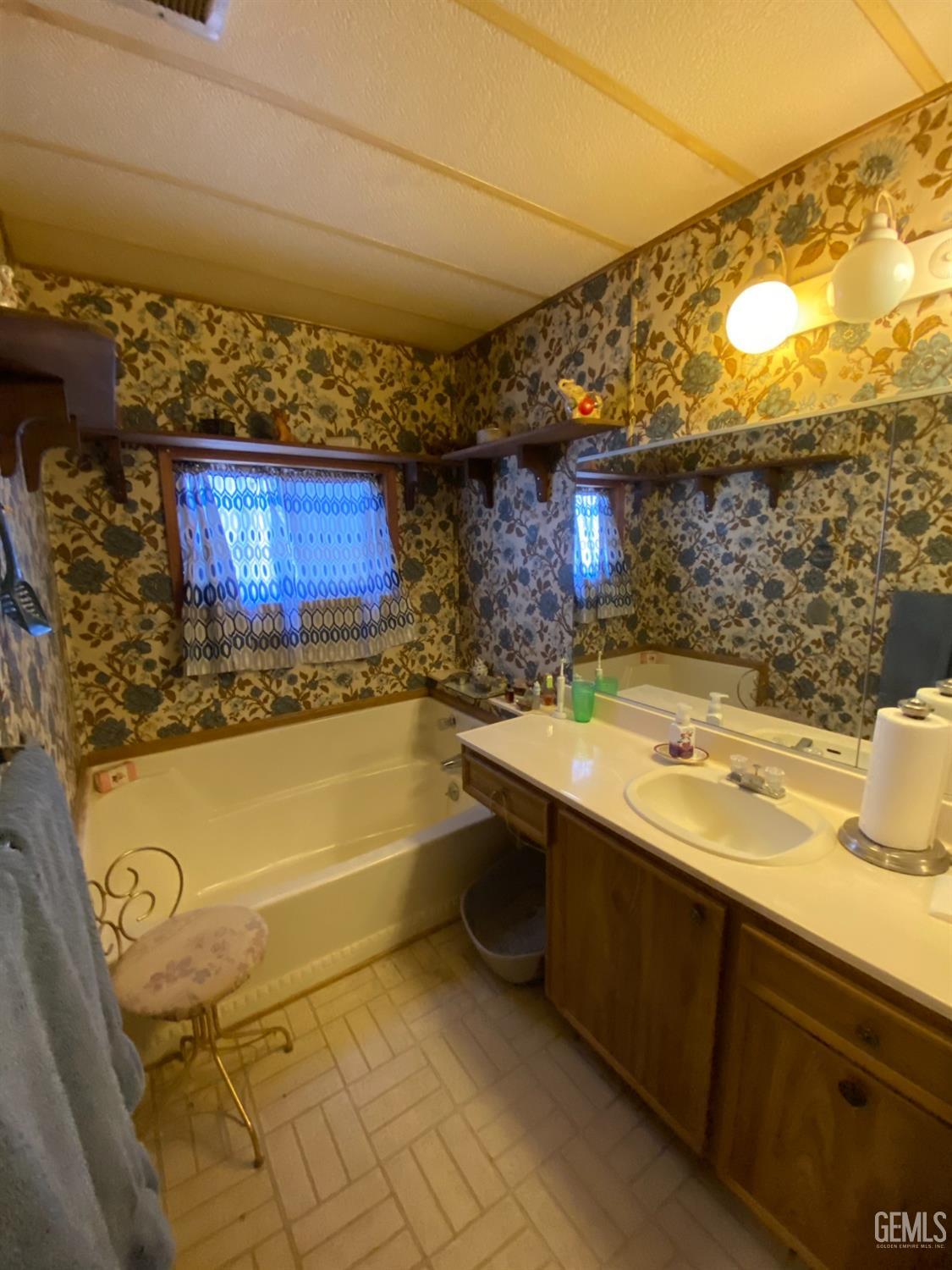 Undisclosed Address Caliente, CA 93518 - Photo 18 of 19 a bathroom with a sink and a large mirror