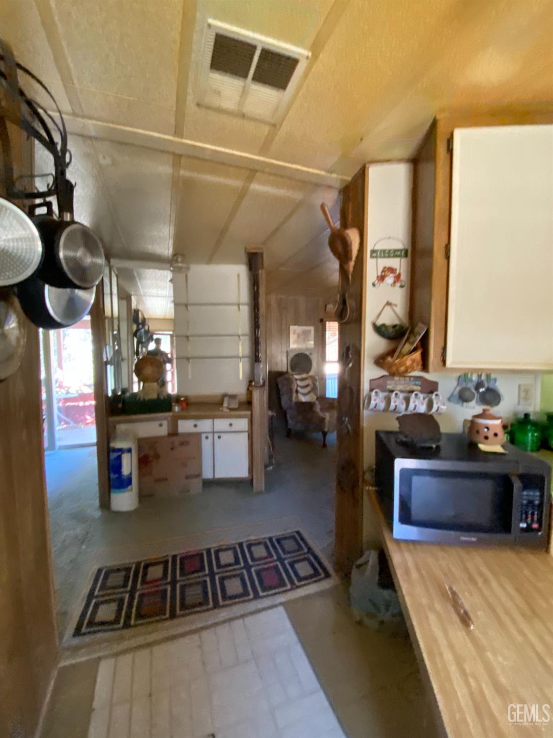 Undisclosed Address Caliente, CA 93518 - Photo 8 of 19 a kitchen with refrigerator and stove