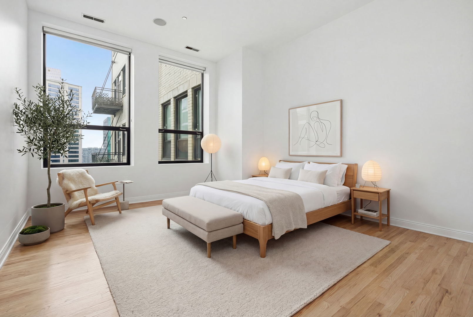 910 South Michigan Avenue, Unit 1908 Chicago, IL 60605 - Photo 11 of 29 a spacious bedroom with a bed and a window