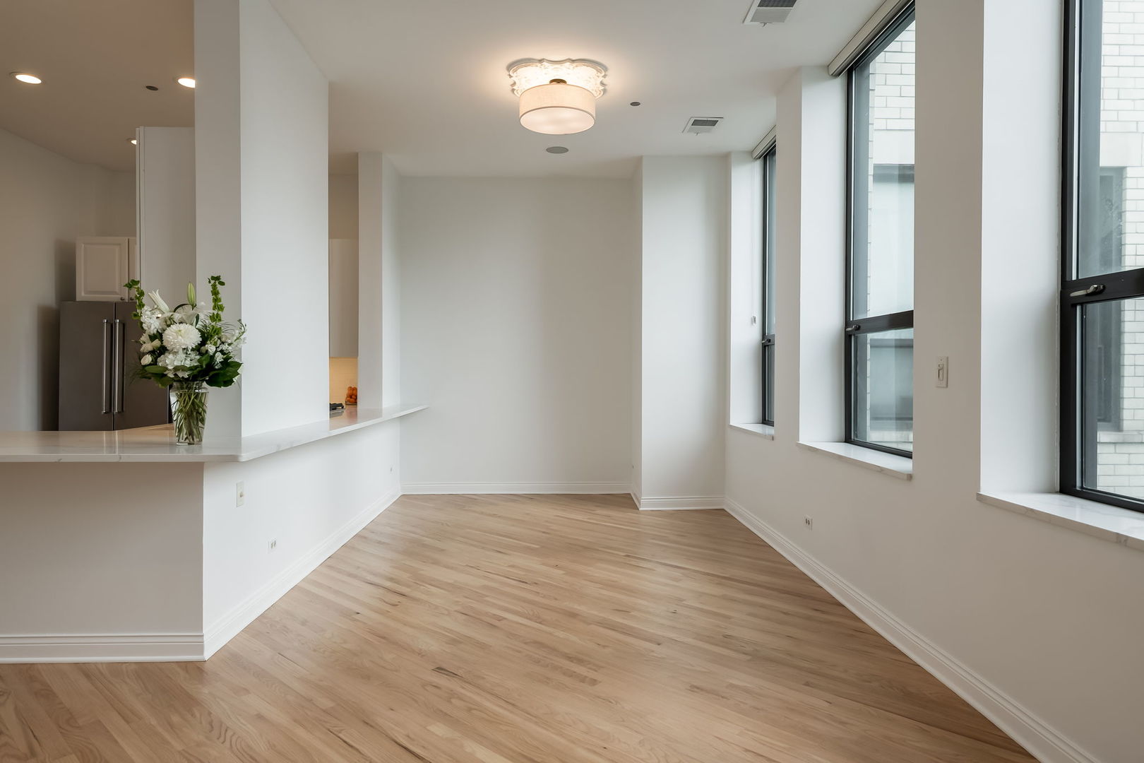 910 South Michigan Avenue, Unit 1908 Chicago, IL 60605 - Photo 6 of 29 a view of an empty room with a window