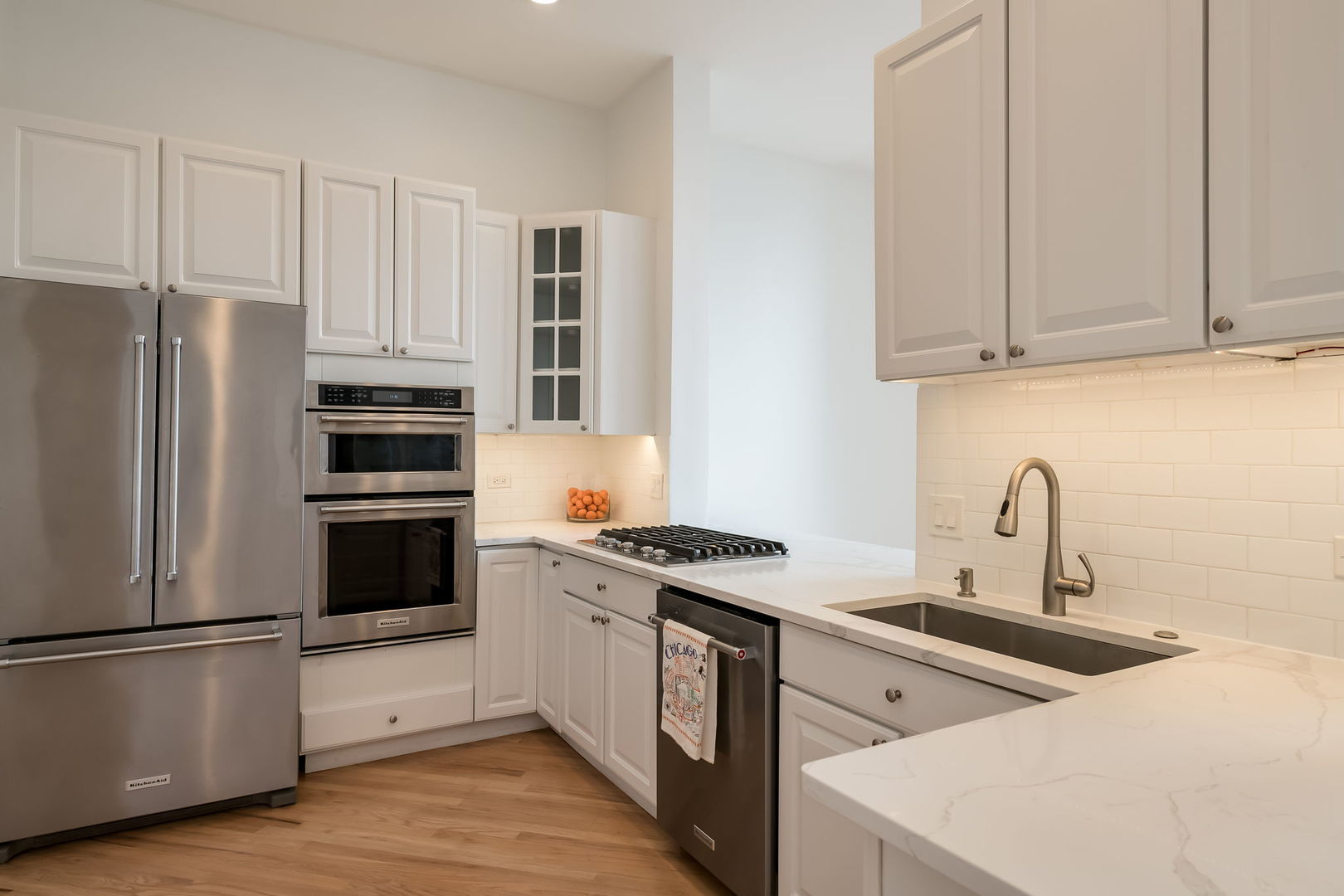 910 South Michigan Avenue, Unit 1908 Chicago, IL 60605 - Photo 7 of 29 a kitchen with stainless steel appliances granite countertop a stove a refrigerator and a sink
