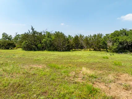 a view of a field with an outdoor space