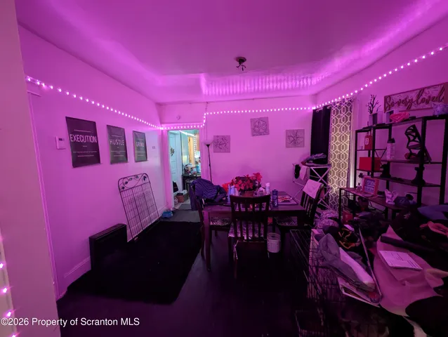 a kitchen with stainless steel appliances a stove a sink refrigerator and a window