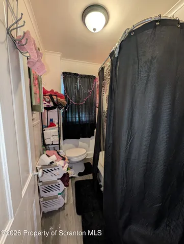 a bedroom with a bed and gym equipment