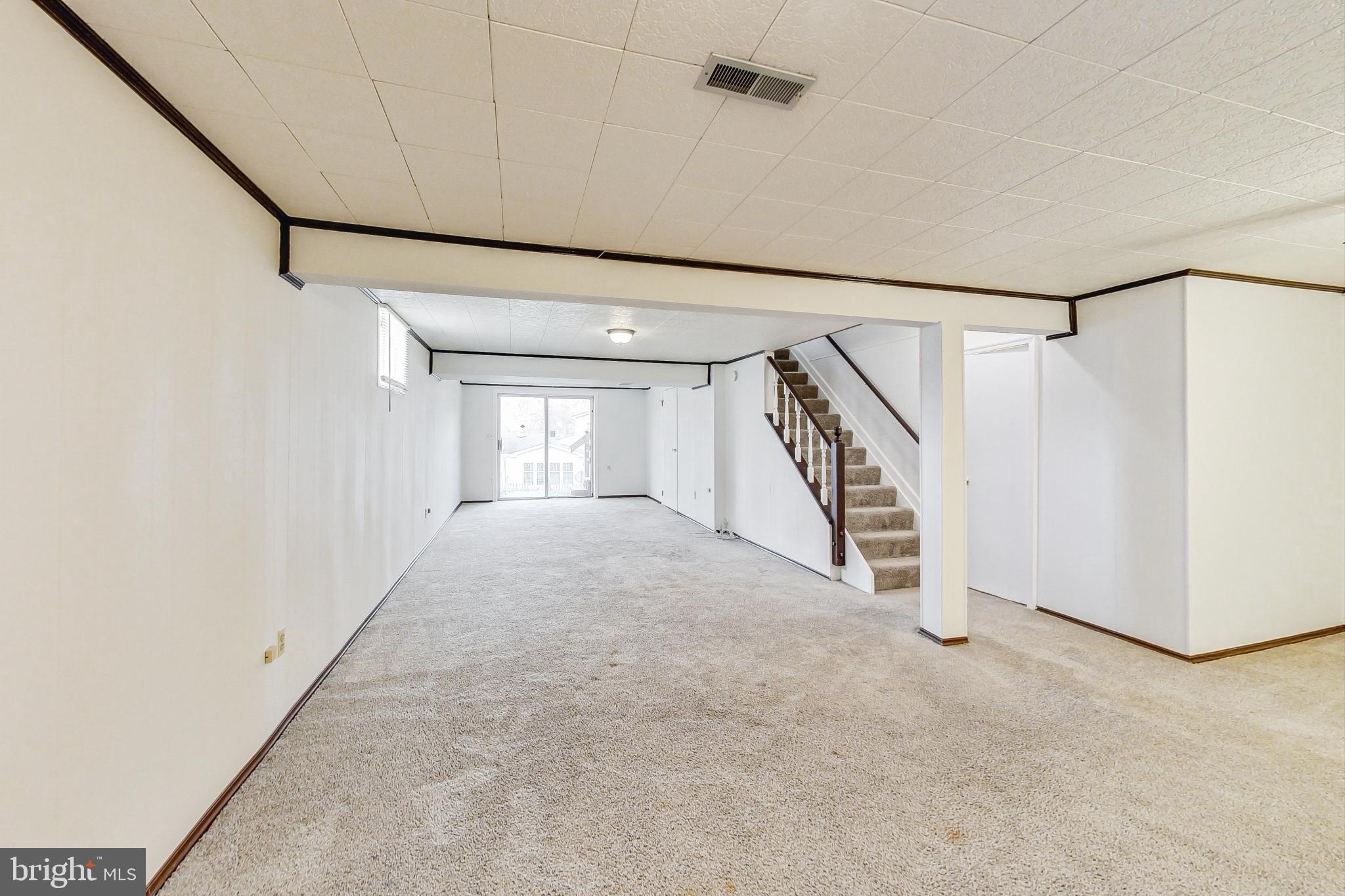 11718 Whittier Road Bowie, MD 20721 - Photo 42 of 70 Basement Recreation Room - Slider to Rear Yard