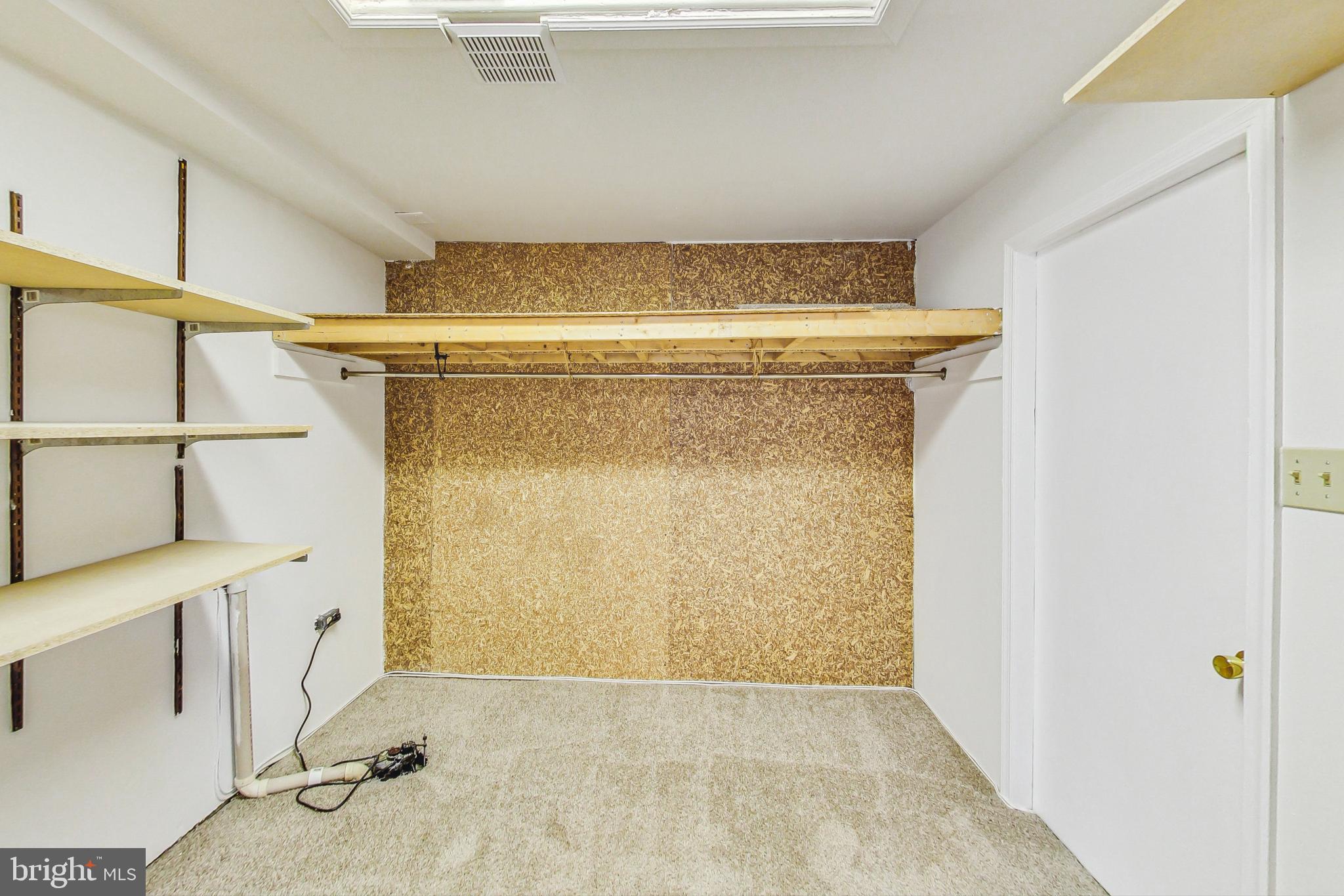 11718 Whittier Road Bowie, MD 20721 - Photo 47 of 70 Basement - Walk-in Storage Closet - Sump pump