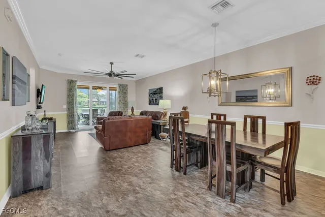 a kitchen with a refrigerator a sink and a stove top oven