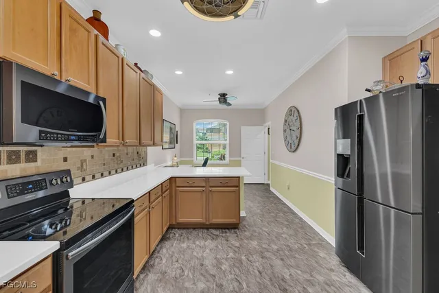 a living room with furniture a ceiling fan and a rug