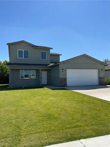a house with yard in front of it