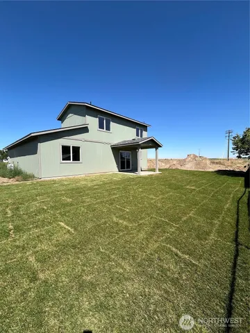 a house with yard in front of it