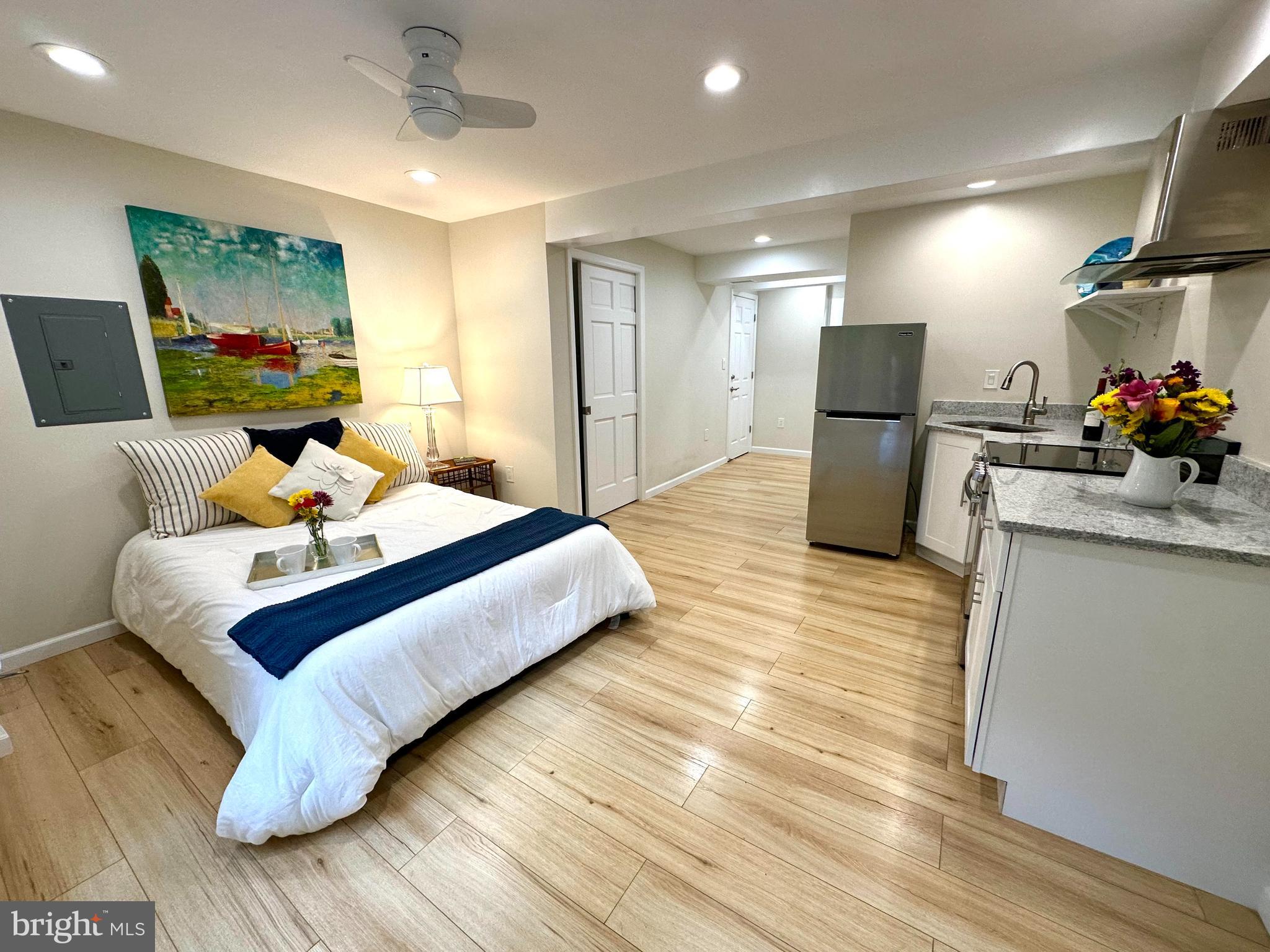 a bedroom with a bed and a couch