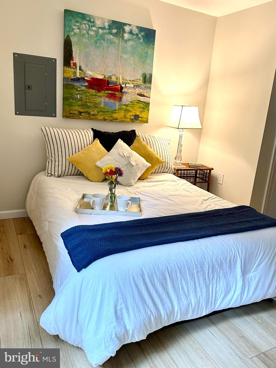 8301 Windfall Road Springfield, VA 22153 - Photo 12 of 27 a bed sitting in a bedroom next to a lamp