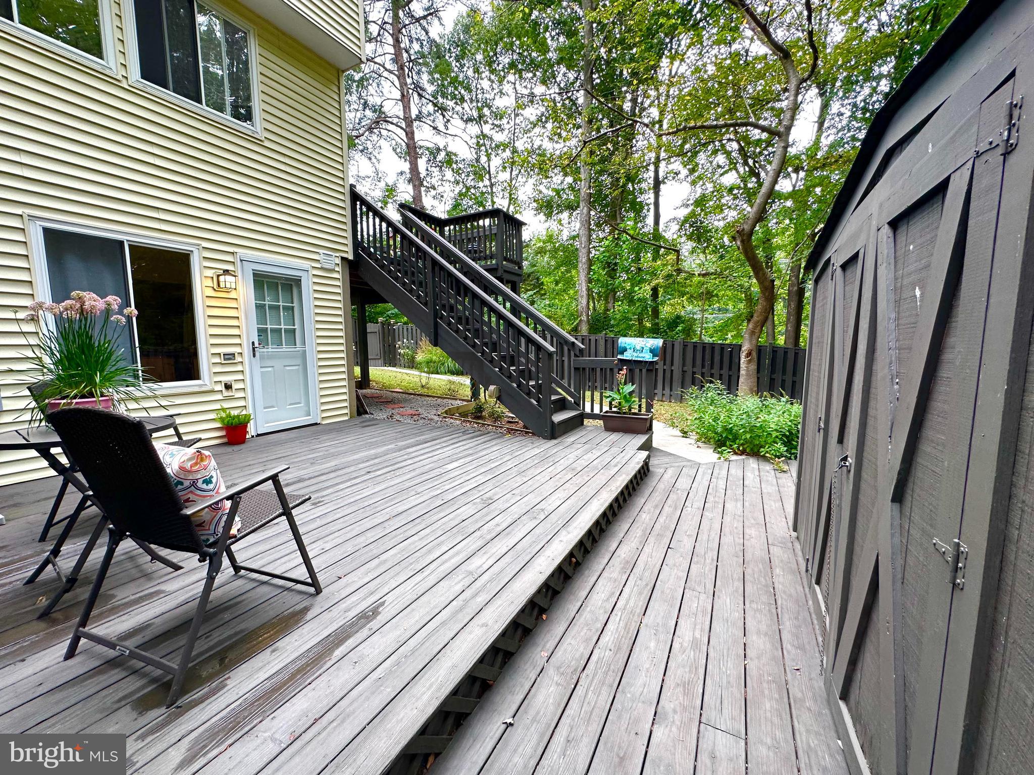 8301 Windfall Road Springfield, VA 22153 - Photo 17 of 27 a view of balcony with wooden floor and outdoor seating