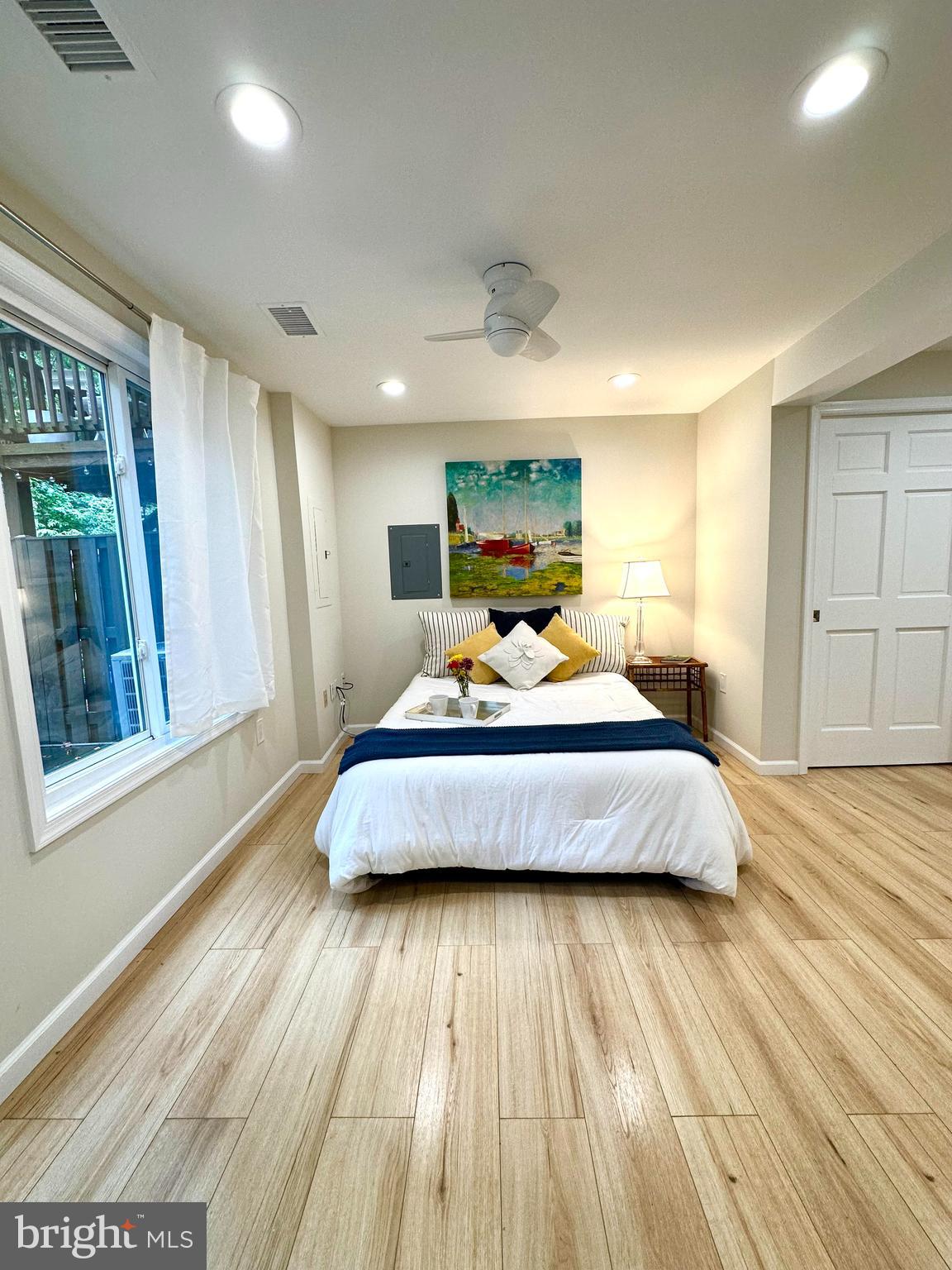 8301 Windfall Road Springfield, VA 22153 - Photo 2 of 27 a bedroom with a bed and wooden floor