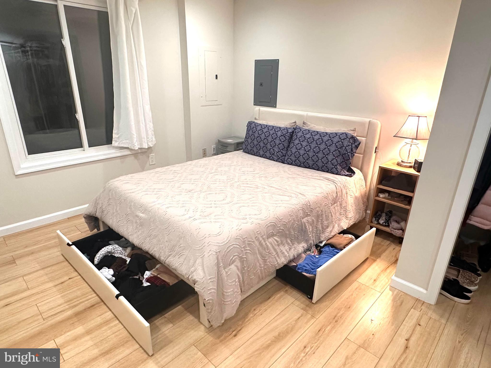 8301 Windfall Road Springfield, VA 22153 - Photo 24 of 27 a bedroom with a bed and wooden floor