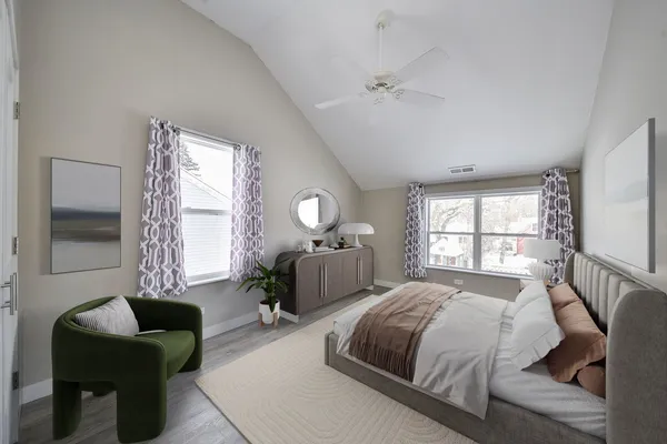 a bedroom with a bed and a couch