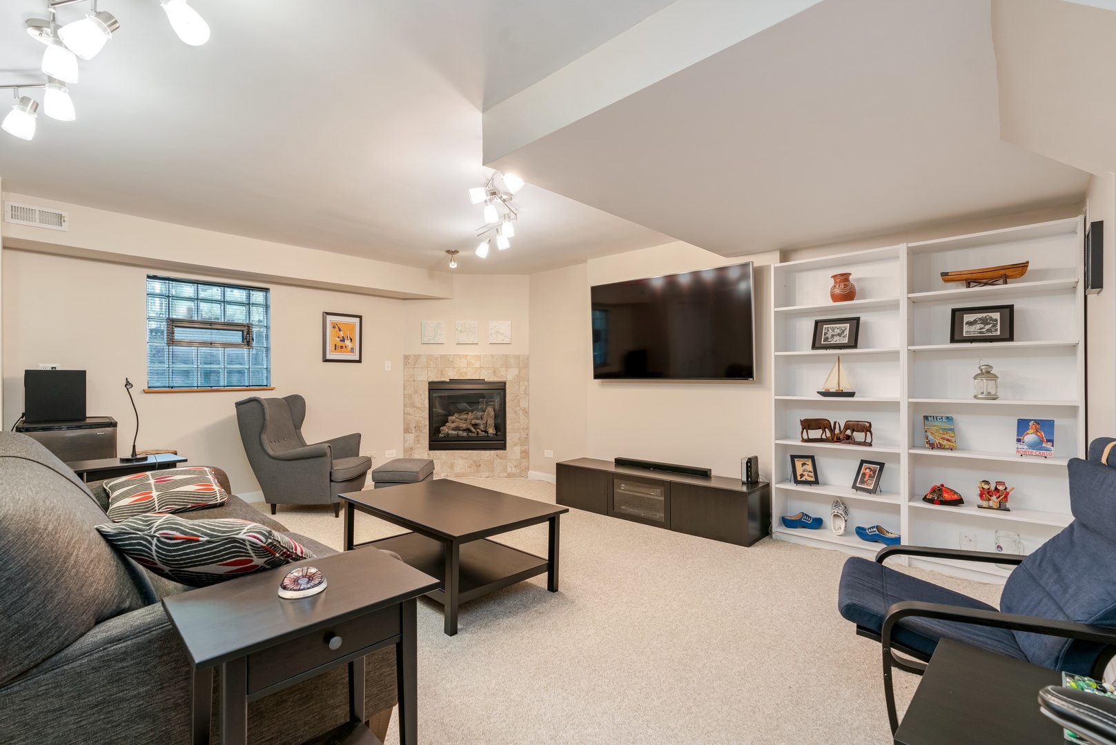 5474 South Ridgewood Court Chicago, IL 60615 - Photo 7 of 14 a living room with furniture a rug and a flat screen tv