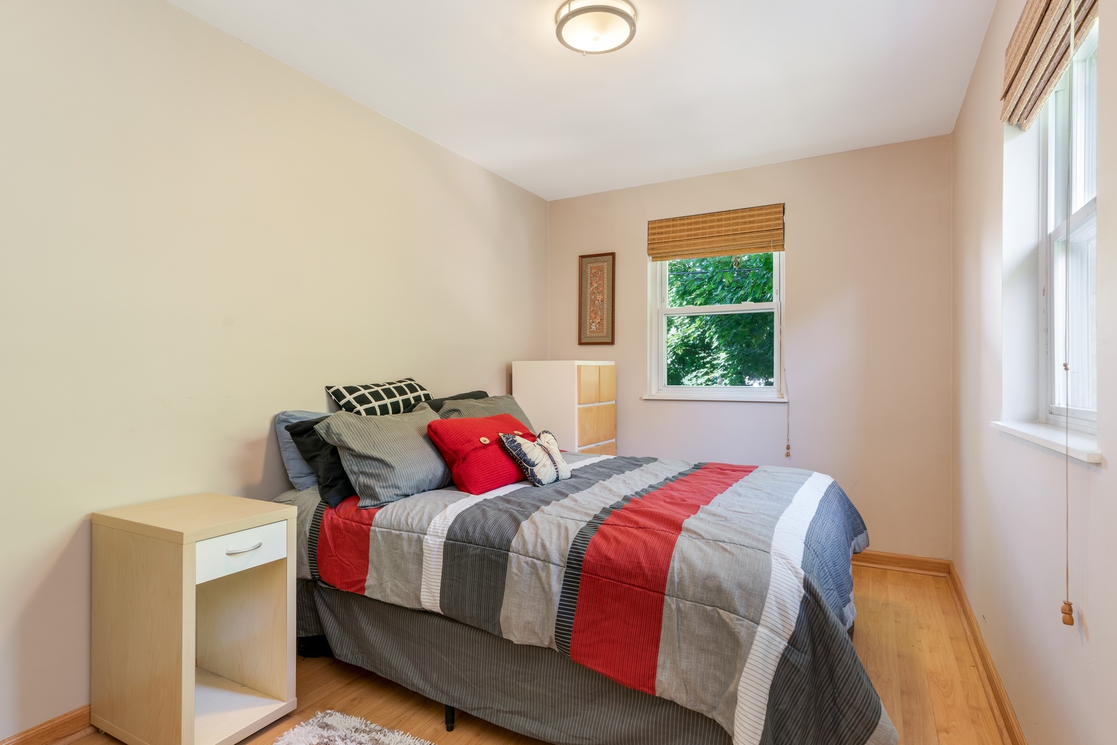 5474 South Ridgewood Court Chicago, IL 60615 - Photo 9 of 14 a bedroom with a bed and a window