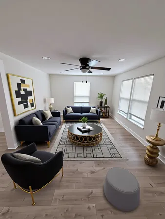 a living room with furniture and a large window