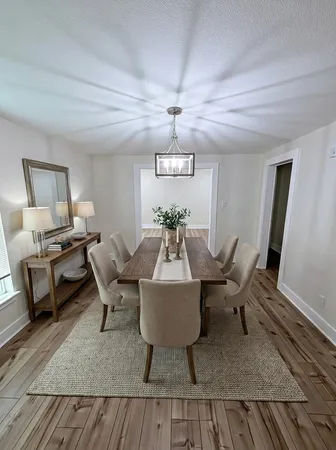 a work room with furniture rug and window
