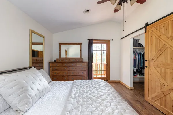 a bedroom with a bed and window