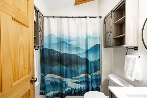 a view of backyard with deck and wooden floor