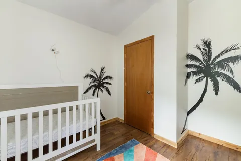 a view of a field of grass and trees