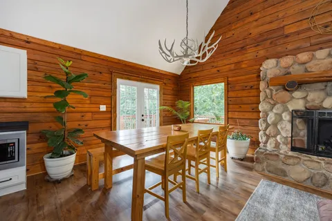a view of a dining room with furniture window and outside view