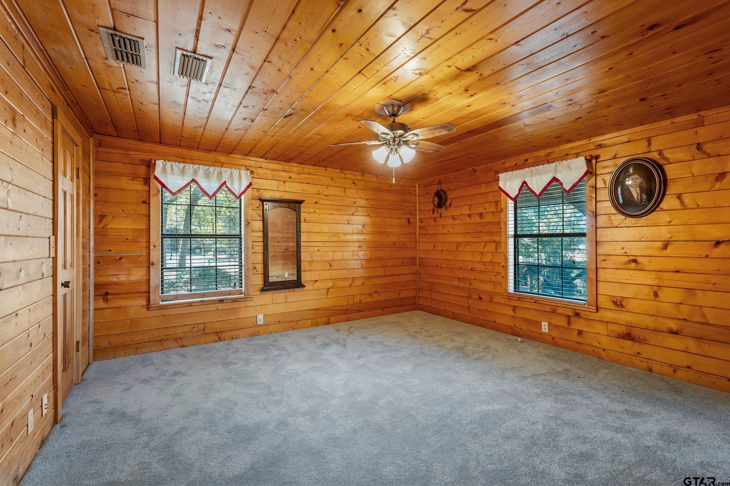 325 Laurel Lane Holly Lake Ranch, TX 75765 - Photo 11 of 34 a view of an empty room with windows