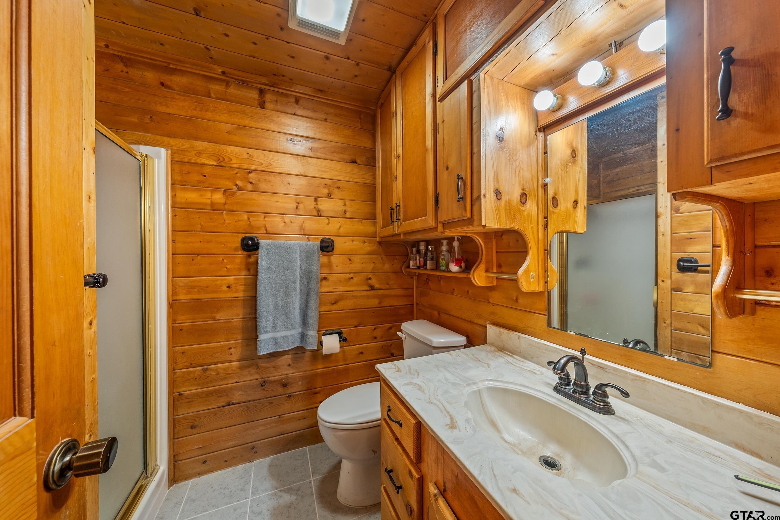 325 Laurel Lane Holly Lake Ranch, TX 75765 - Photo 13 of 34 a bathroom with a sink and a mirror