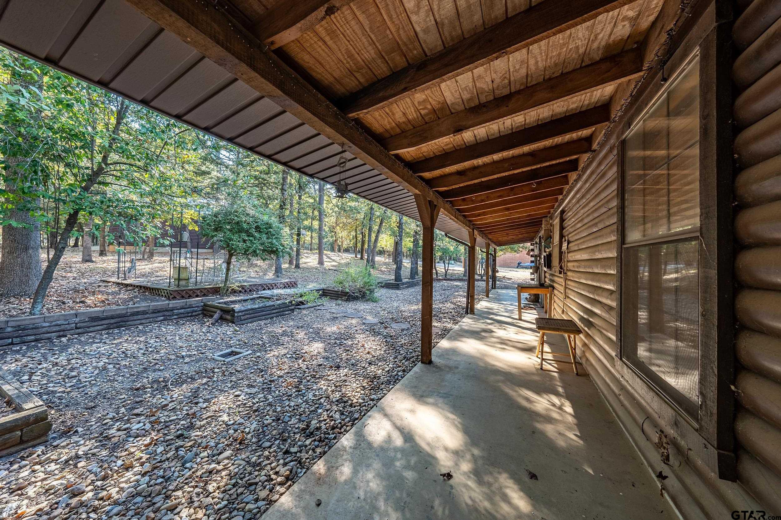 325 Laurel Lane Holly Lake Ranch, TX 75765 - Photo 20 of 34 a view of a backyard with wooden floor