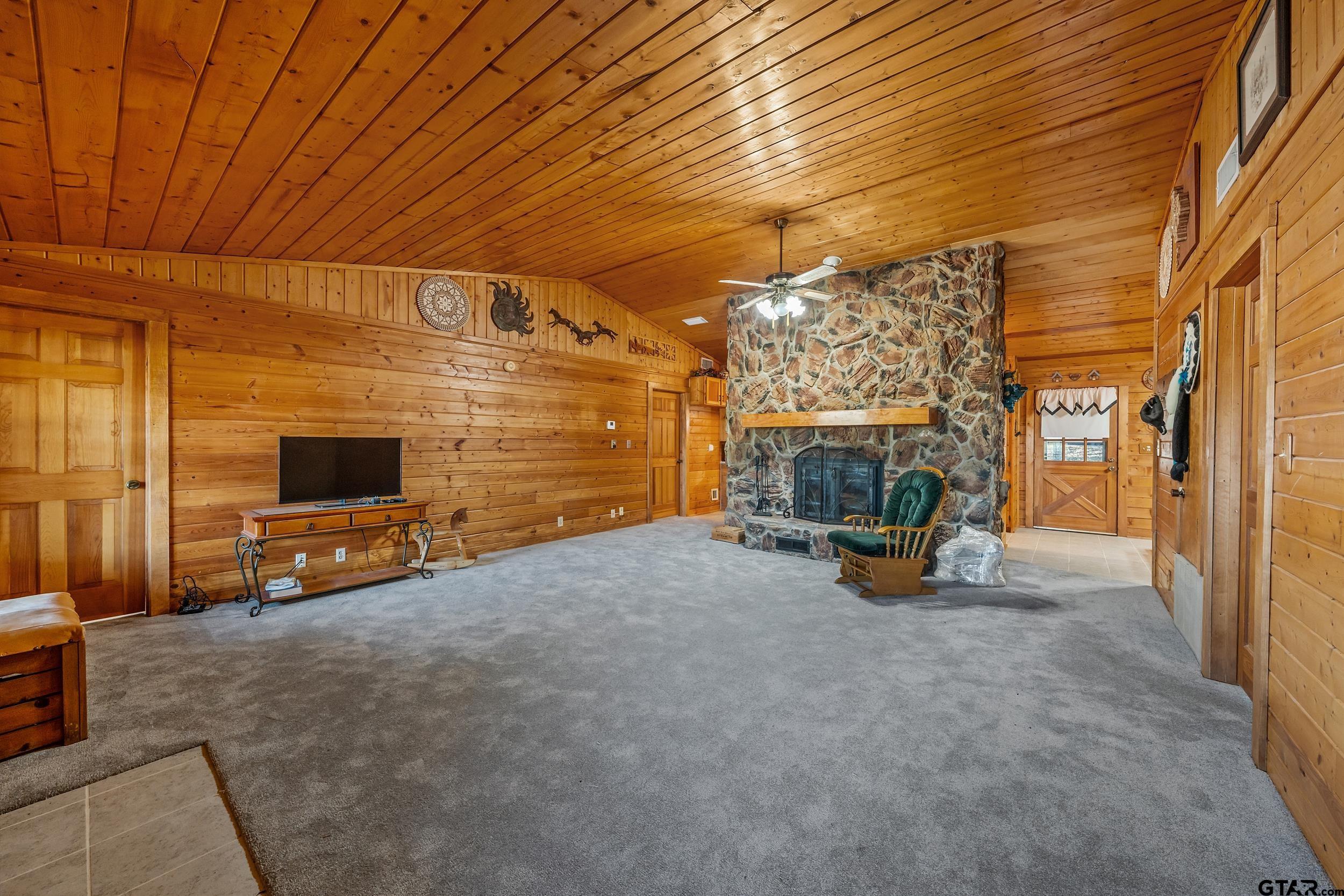 325 Laurel Lane Holly Lake Ranch, TX 75765 - Photo 2 of 34 a view of a room with furniture and a fireplace