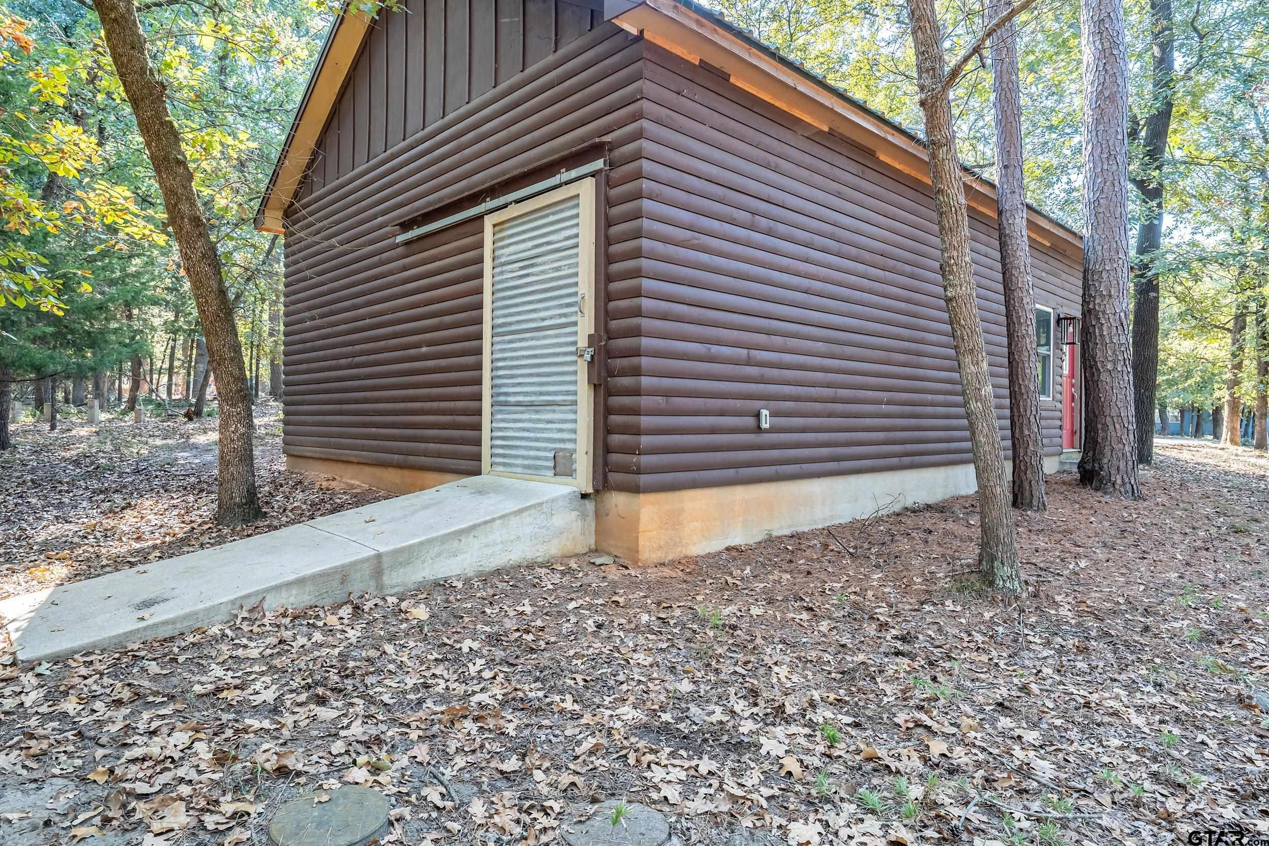 325 Laurel Lane Holly Lake Ranch, TX 75765 - Photo 26 of 34 a front view of a house
