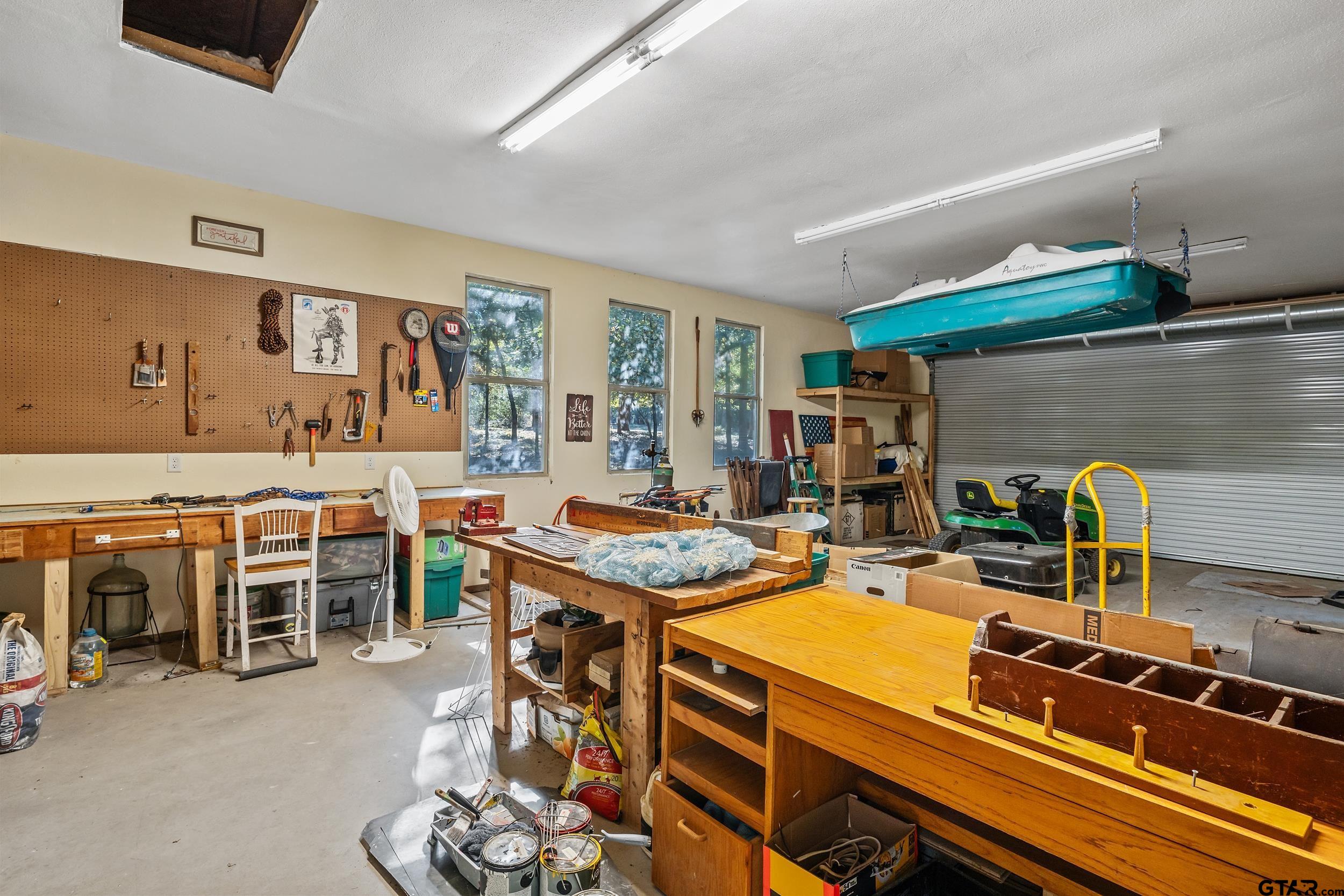 325 Laurel Lane Holly Lake Ranch, TX 75765 - Photo 28 of 34 a room with furniture a flat screen tv and gym equipment