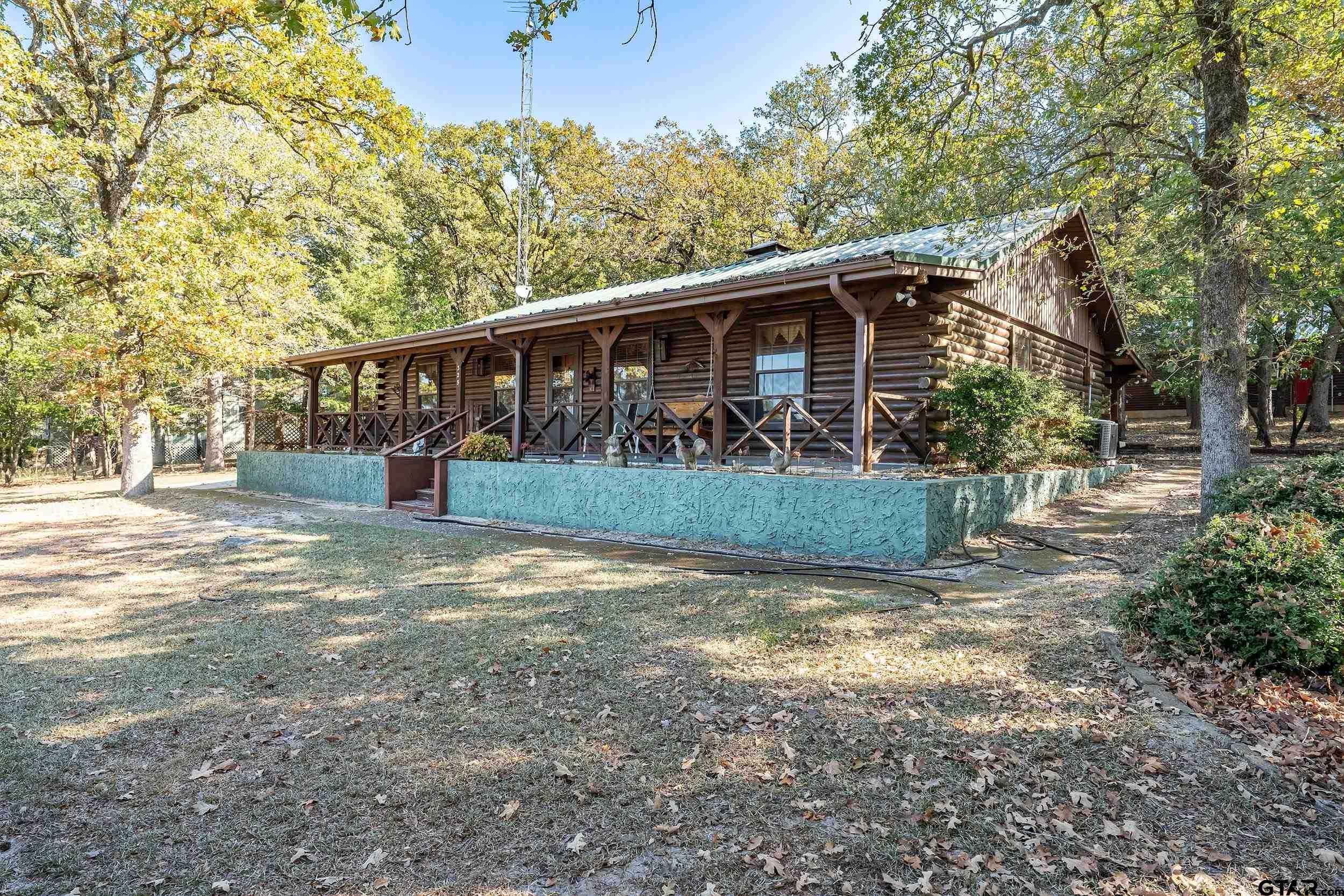 325 Laurel Lane Holly Lake Ranch, TX 75765 - Photo 34 of 34 a view of a yard with large tree