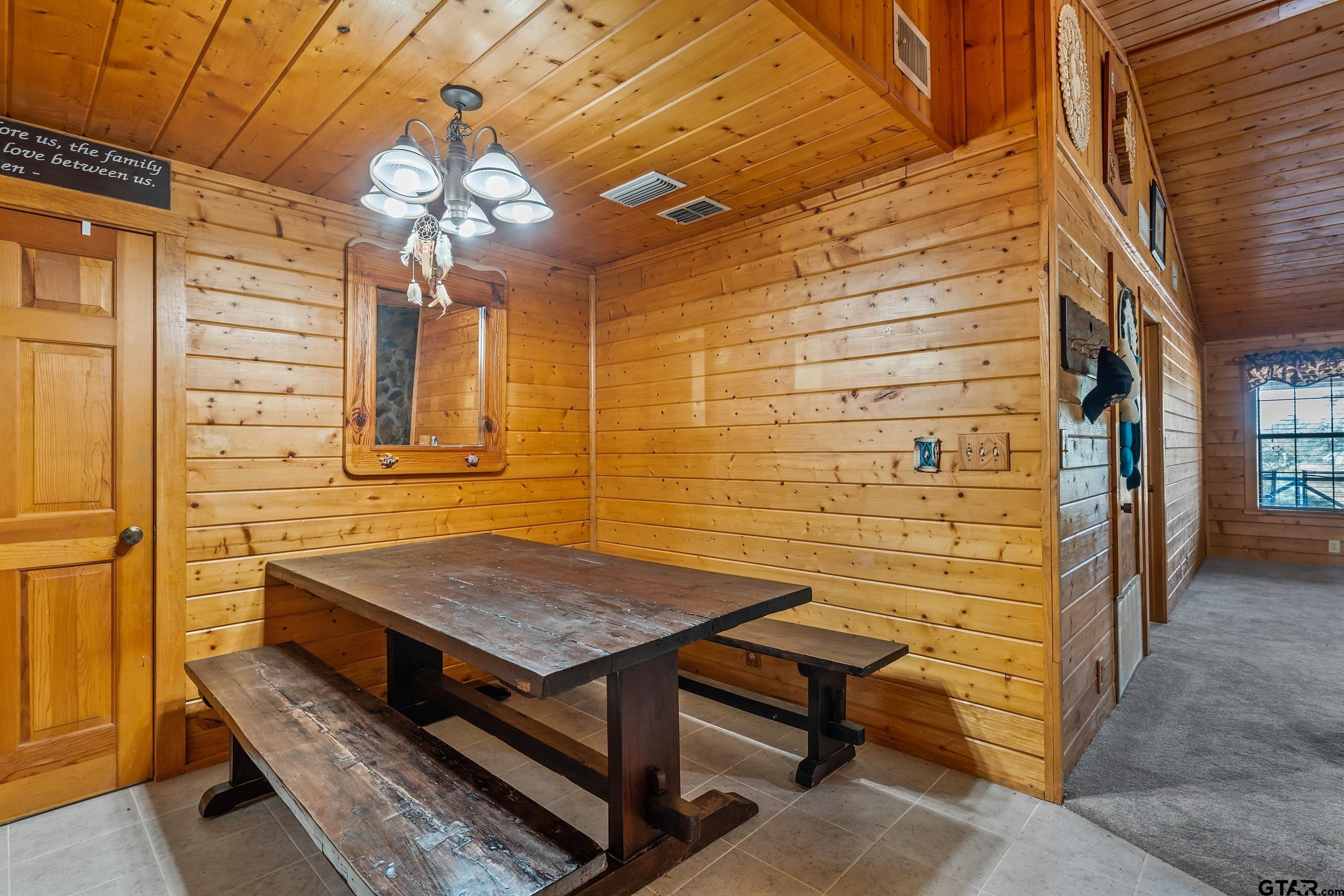 325 Laurel Lane Holly Lake Ranch, TX 75765 - Photo 10 of 34 a view of a wooden door and chair in the patio