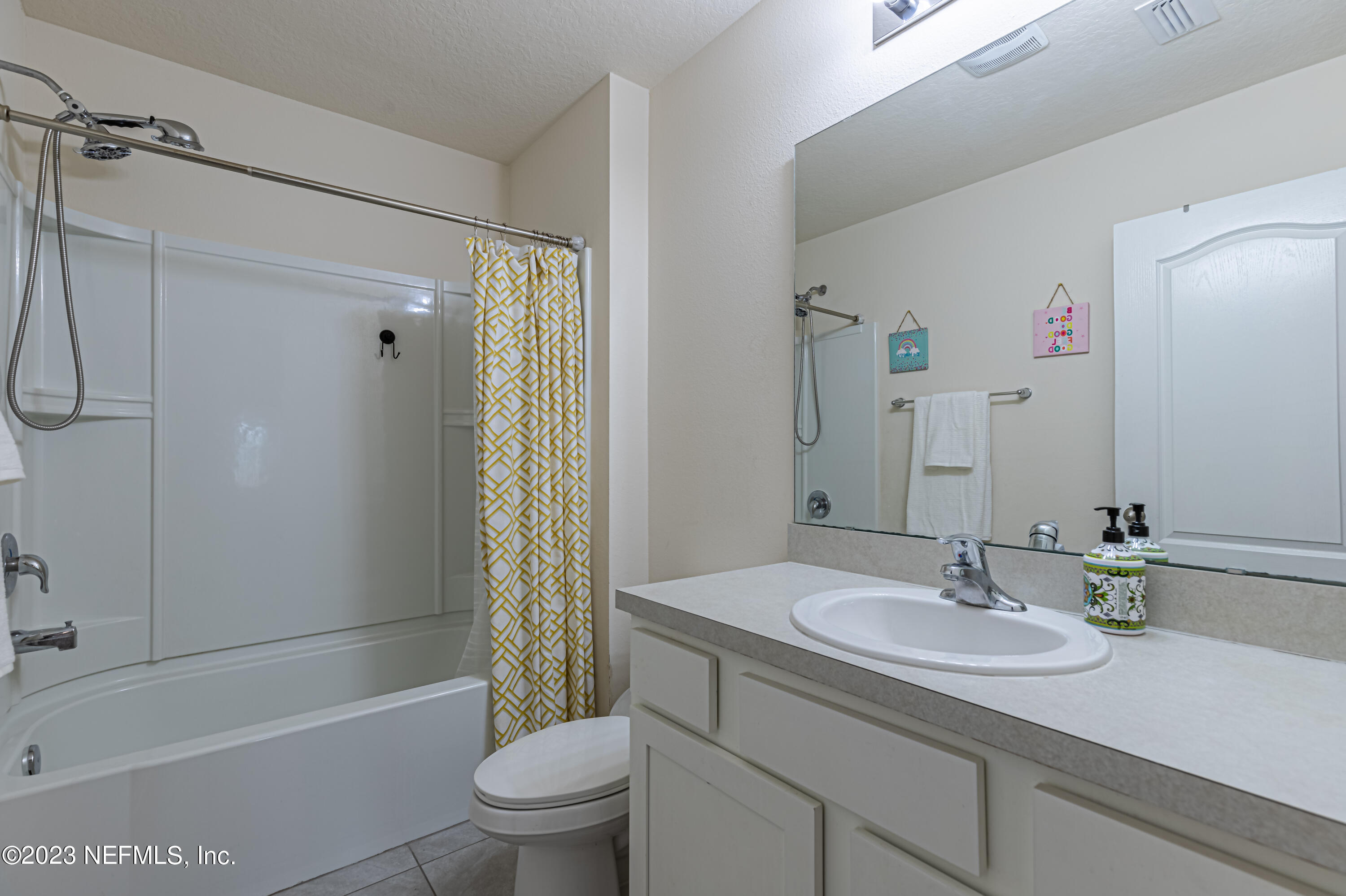 86205 Mainline Road Yulee, FL 32097 - Photo 14 of 19 a bathroom with a sink toilet and shower