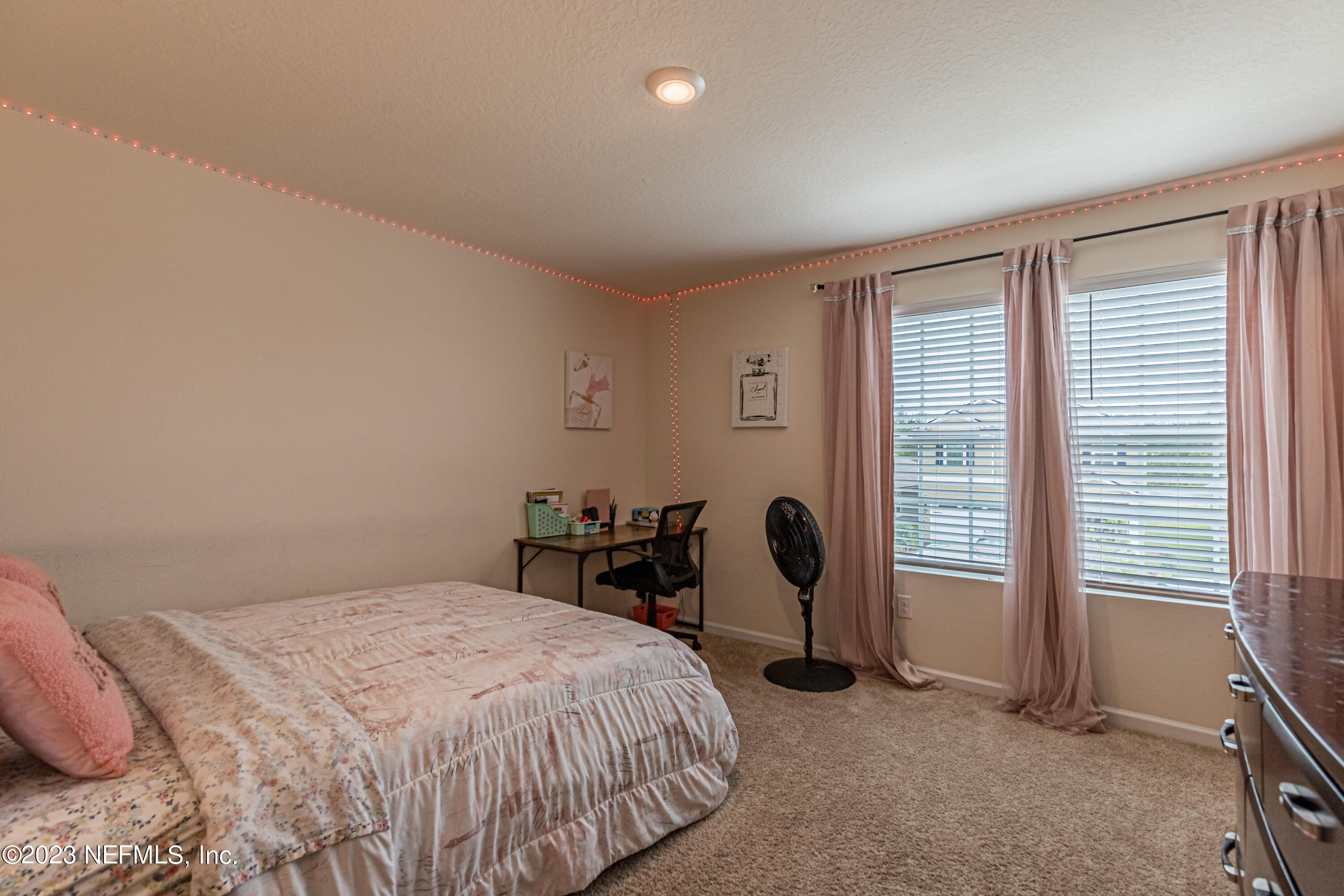 86205 Mainline Road Yulee, FL 32097 - Photo 15 of 19 a bedroom with a bed and a table