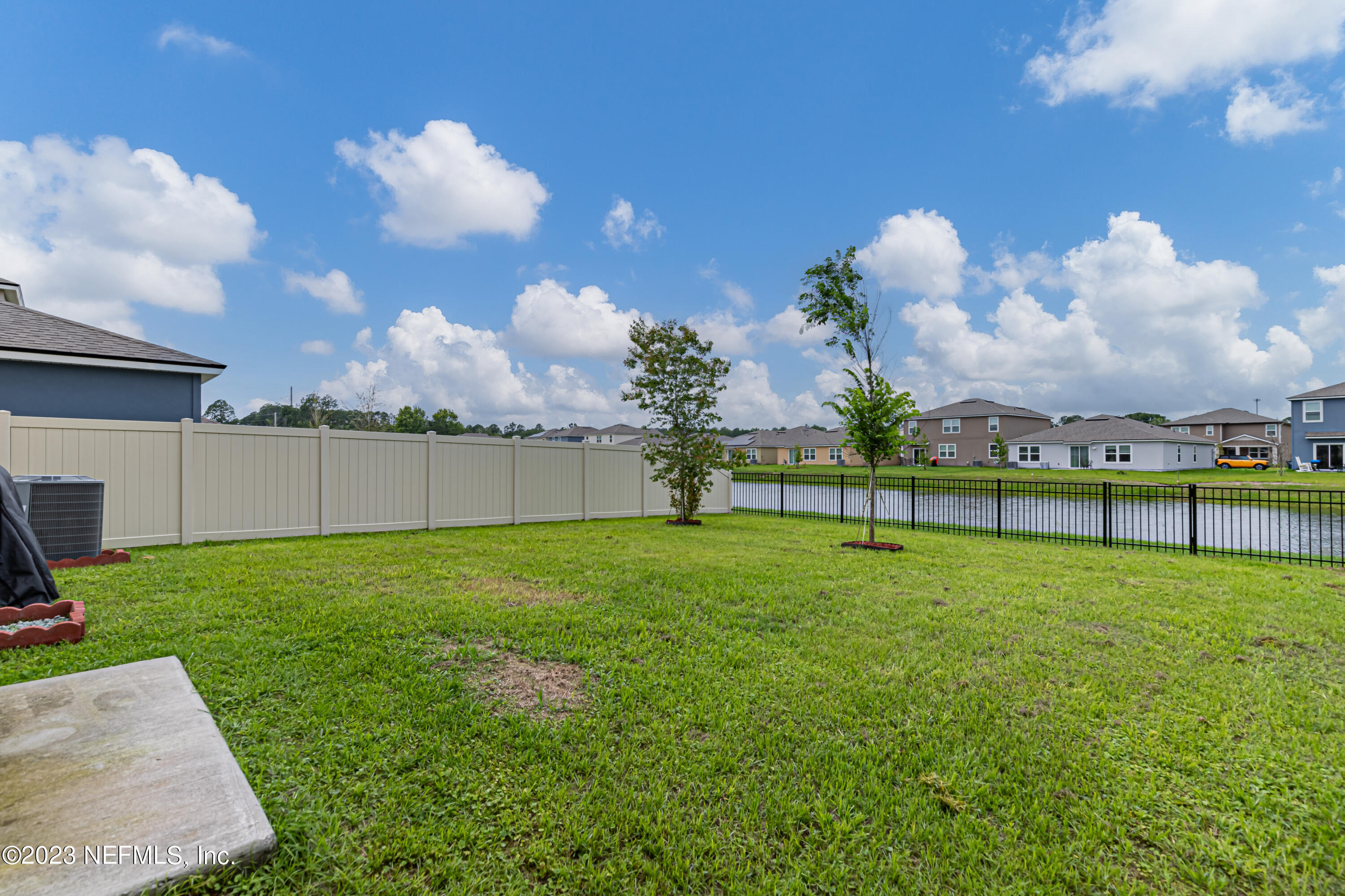 86205 Mainline Road Yulee, FL 32097 - Photo 17 of 19 a view of a golf course with a lake
