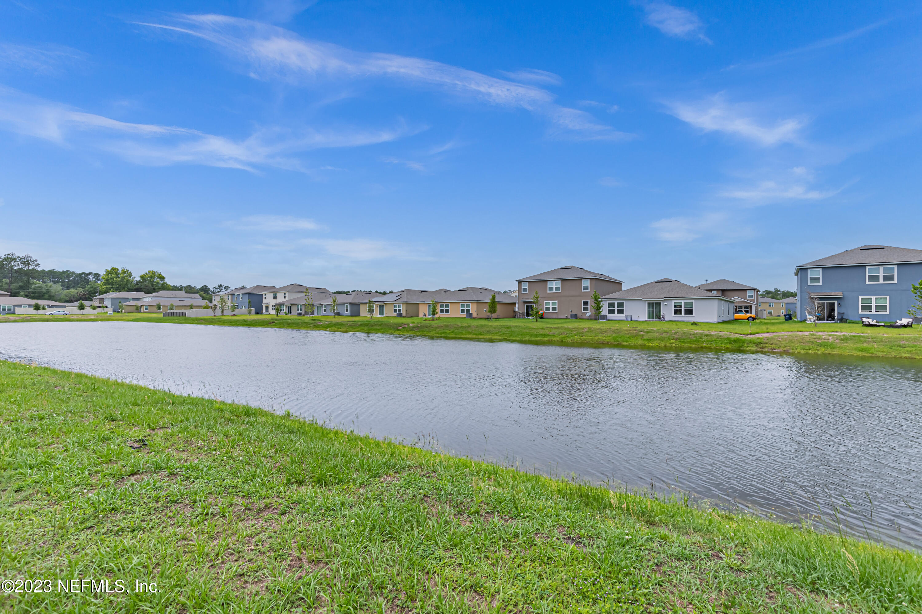 86205 Mainline Road Yulee, FL 32097 - Photo 19 of 19 a view of a lake with a big yard