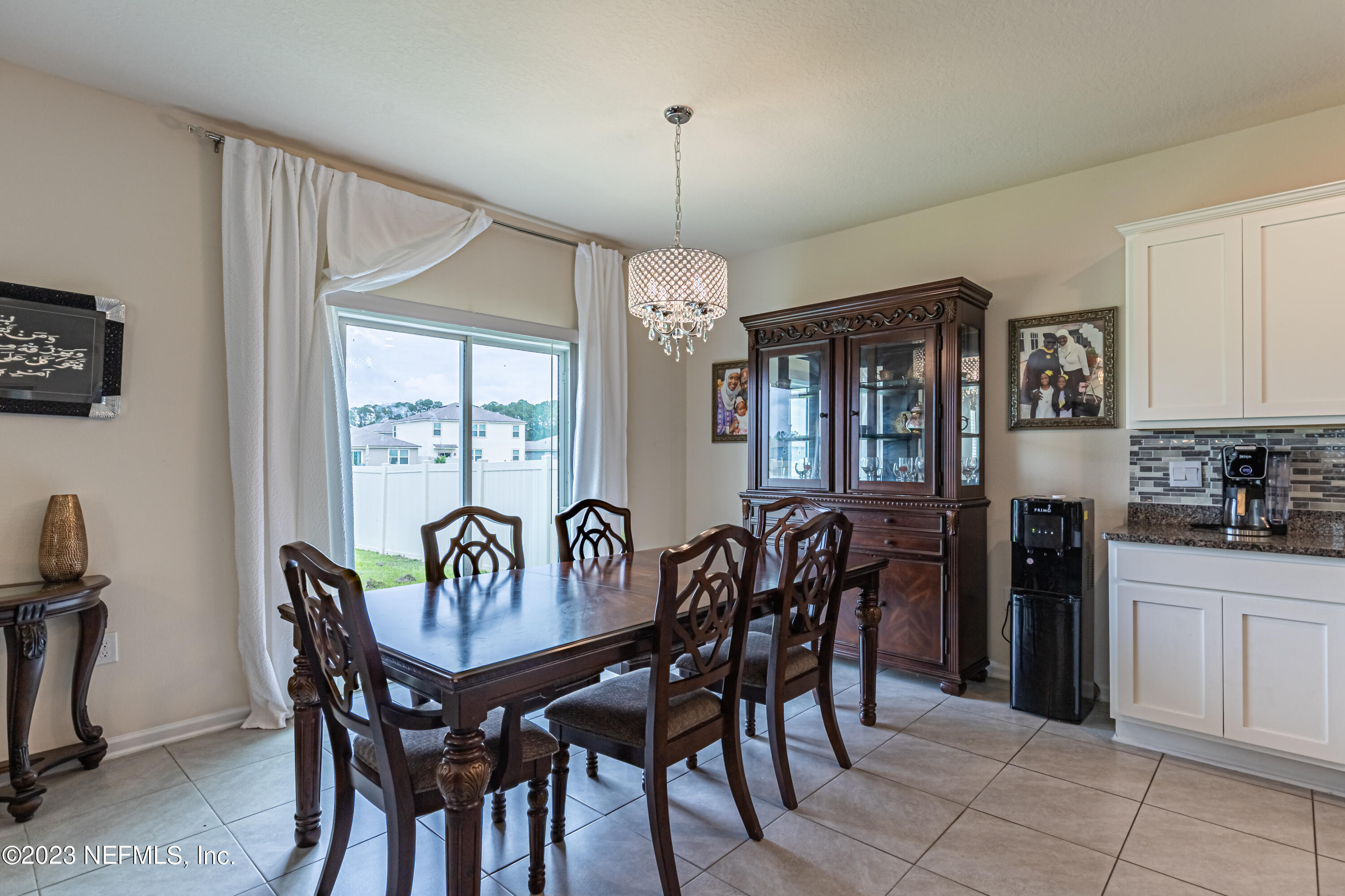 86205 Mainline Road Yulee, FL 32097 - Photo 5 of 19 a view of a dining room with furniture window and outside view