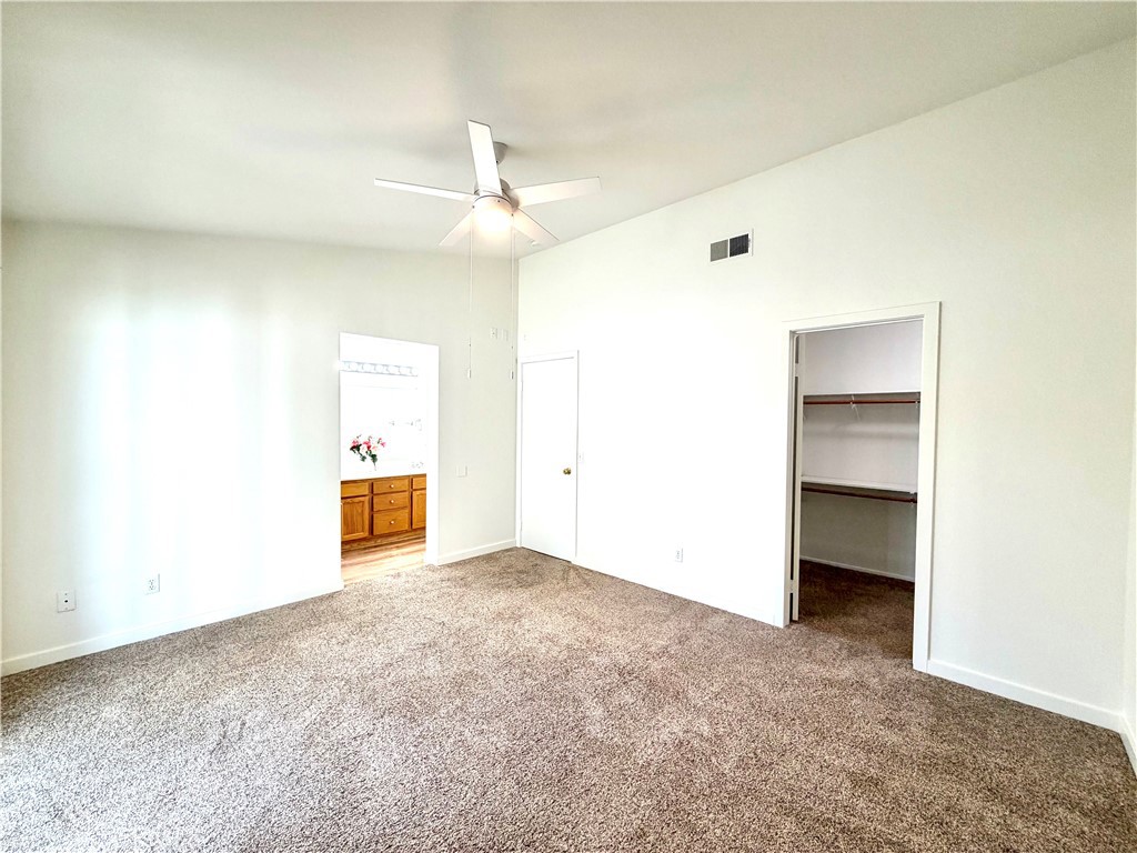 44836 Marge Place Temecula, CA 92592 - Photo 14 of 35 an empty room with a ceiling fan and a window
